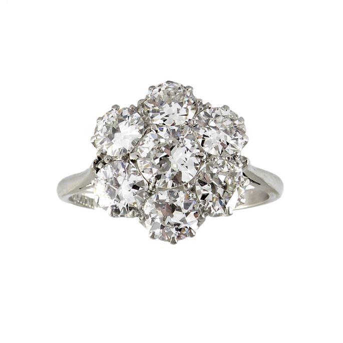 Mid-20th century diamond flowerhead cluster ring, c.1950, circular, with seven old round European cut diamonds, the largest to centre, | MasterArt